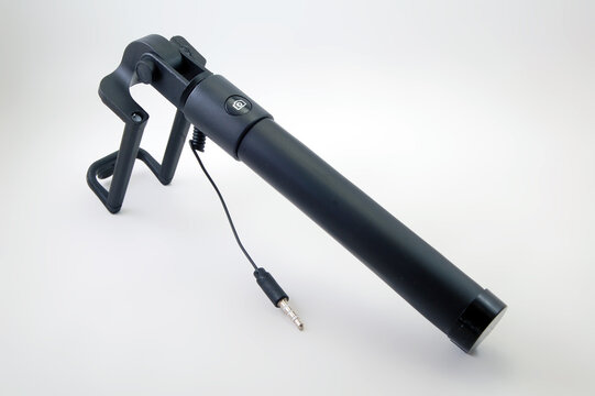 Black selfie stick with shutter button