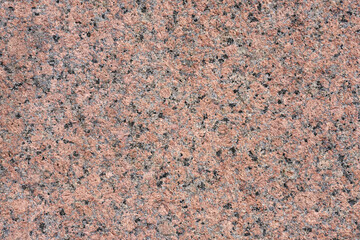 Natural background of red treated granite.