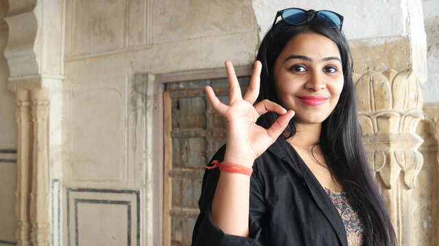 Young Indian happy female showing "waa" gesture