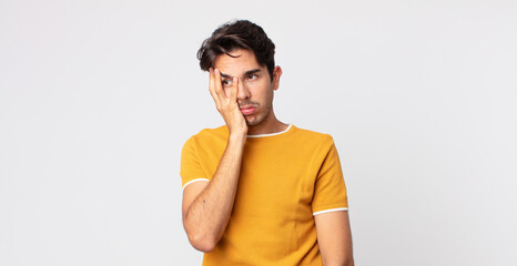 hispanic handsome man feeling bored, frustrated and sleepy after a tiresome, dull and tedious task,...