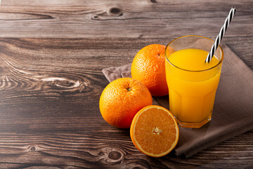 Glass with orange juice on the table. © WS Studio