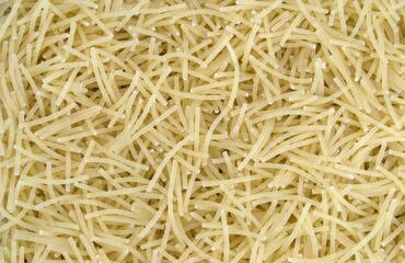 Dry flour noodles are neatly laid out