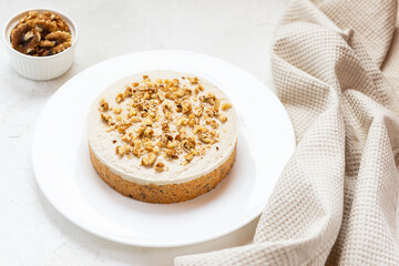 No baked vegan carrot cake with coconut cream and walnuts. Sugar, gluten and lactose free.