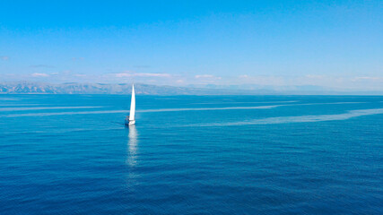 Fototapeta premium Aerial view of sailing luxury yacht at opened sea at sunny day in Croatia