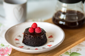 Healthy chocolate fondant.Chocolate fondant decorated with berries.Chocolate dessert with glaze without harm to health.A healthy dessert without sugar and flour.Banana chocolate cake.Diet sweetness