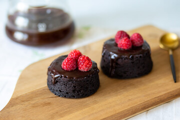 Healthy chocolate fondant.Chocolate fondant decorated with berries.Chocolate dessert with glaze without harm to health.A healthy dessert without sugar and flour.Banana chocolate cake.Diet sweetness