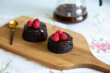 chocolate fondant cake. Mini cake for fondant with icing. Delicious  dessert.Homemade chocolate lava cake.Fondant Lava Cupcake.Warm chocolate dessert.Chocolate cake.Cupcake with berries.Breakfast 