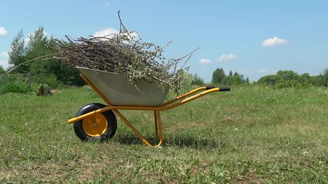 Wheelbarrow for the garden work farm, countryside village summer organic ools park. Tool arden carry, season planting wheelbarrow garden wheel barrow enjoy dirt