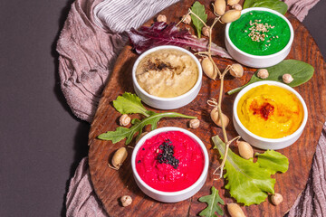 Colorful hummus bowls, healthy vegan dips