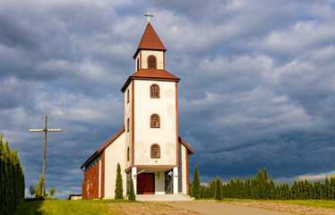 Parish country church Our Lady of Ostra Brama in Sedki village at Jezioro Selmet Wielki lake in Masuria region of Poland - obrazy, fototapety, plakaty