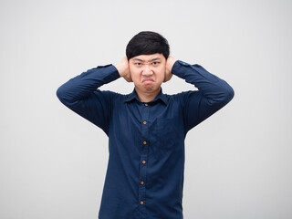 Angry man close his ear with unhappy face portrait white background,Asian angry emotion