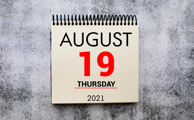 tear-off calendar sheet with date August 19, concept