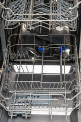 an empty dishwasher from the inside. household appliances for the kitchen
