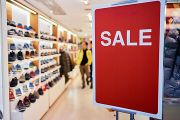 Big red sale sign in the shop.