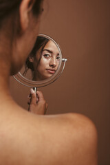 Woman looking in the mirror