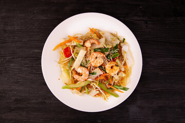 seafood with sesame, served with glass noodles and carrots