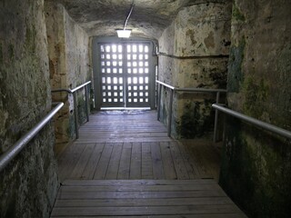 Wooden floors and hallways leading to an exit at the underground chambers of Fort Charlotte, Nassau.