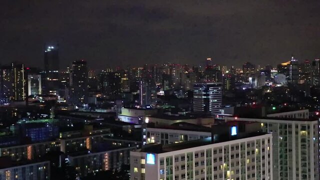 City panorama Bangkok by night skyscraper cityscape and lights Thailand.