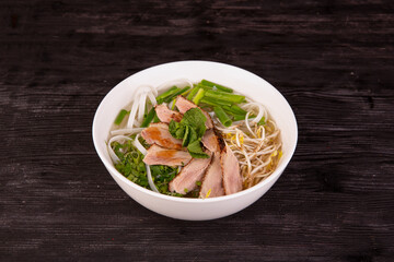 rice noodles, broth, beef, bean sprouts, onions