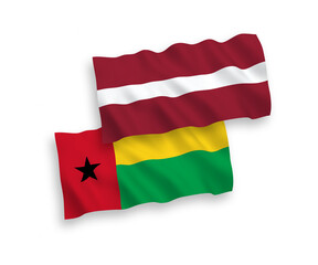 Flags of Latvia and Republic of Guinea Bissau on a white background