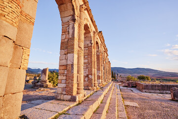 Beautiful sunset lanscape. The ancient antigue roman city Volubilis in Morocco, Africa.
