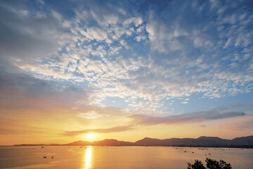 Fototapeta na wymiar Beautiful landscape. Colorful sunset on the sea shore.