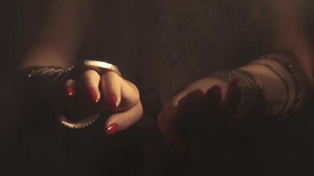 Sensual woman dancing in light and shadow