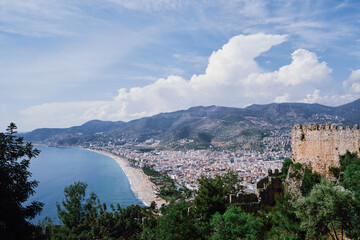 Beautiful view of Alanya city with mountains and sea bay.