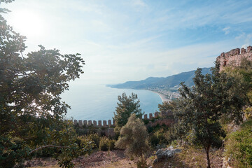 Ancient  wall of the medieval fortress castle of Alanya with sea view, Turkey. - obrazy, fototapety, plakaty