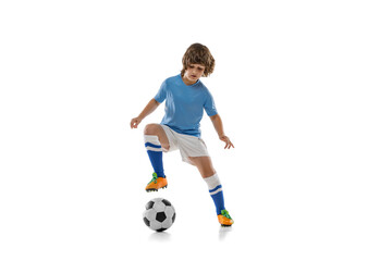 Fototapeta na wymiar One preschool boy, football soccer player in action, motion training isolated on white studio background. Concept of sport, game, hobby