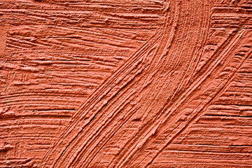 Red plaster wall exterior with grain texture