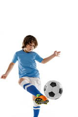 Close-up young male football soccer player, boy training with football ball isolated on white studio background. Concept of sport, game, hobby