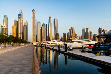 Fototapeta na wymiar Dubai, UAE - 07.19.2021 View of a towers in Dubai Marina district from Dubai harbor. Outdoors
