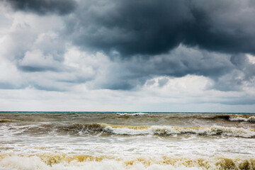 Storm clouds over the sea. Dramatic sky and giant waves