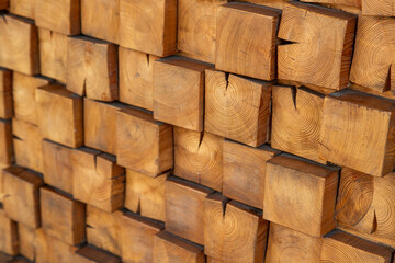 Wooden, textured wall lined with wooden cubes, longitudinal cuts of a fir tree. Cubes in the dioganal projection.