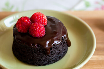 chocolate fondant cake. Mini cake for fondant with icing. Delicious  dessert.Homemade chocolate lava cake.Fondant Lava Cupcake.Warm chocolate dessert.Chocolate cake.Cupcake with berries.Breakfast 