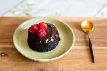 chocolate fondant cake. Mini cake for fondant with icing. Delicious  dessert.Homemade chocolate lava cake.Fondant Lava Cupcake.Warm chocolate dessert.Chocolate cake.Cupcake with berries.Breakfast 