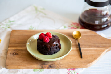 chocolate fondant cake. Mini cake for fondant with icing. Delicious  dessert.Homemade chocolate lava cake.Fondant Lava Cupcake.Warm chocolate dessert.Chocolate cake.Cupcake with berries.Breakfast 
