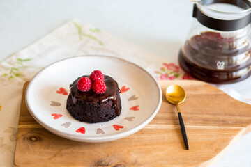 chocolate fondant cake. Mini cake for fondant with icing. Delicious  dessert.Homemade chocolate lava cake.
Fondant Lava Cupcake.Warm chocolate dessert.Chocolate cake.Cupcake with berries.Sweet.