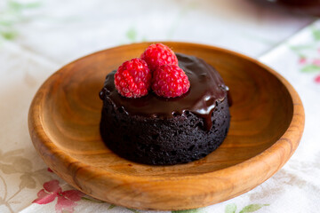 chocolate fondant cake. Mini cake for fondant with icing. Delicious  dessert.Homemade chocolate lava cake.
Fondant Lava Cupcake.Warm chocolate dessert.Chocolate cake.Cupcake with berries.Sweet.