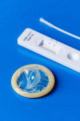 condom and covid-19 rapid antigen test device