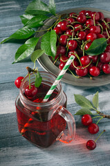 Cherry juice and ripe cherries