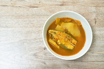 boiled red mango fish with pickled bamboo shoot in spicy and sour soup on bowl