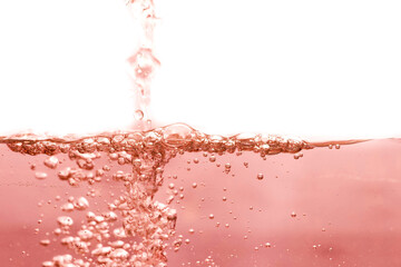 The surface of the red orange water ripples looks like beer.