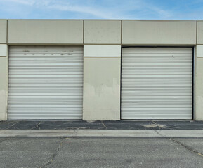 2 pair of warehouse shipping industrial shipment roll up door storage concrete factory building