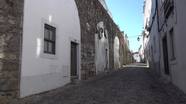 Homes are built under historic aquaduct in famous Evora town in Portugal, making inventive use of existing structures 
