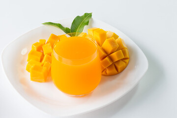 R2E2 mangoes juice fruit in glass and slice on dish .concept organic fruit and vitamin healthy.
