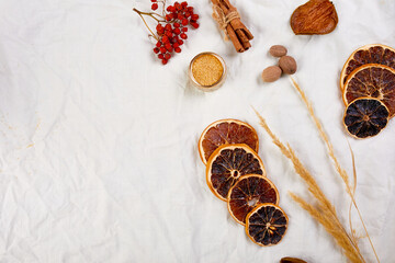 Flat lay of ingredients and bottle of red wine for winter seasonal mulled wine