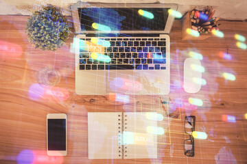 Double exposure of data theme drawing hologram over topview work table background with computer....