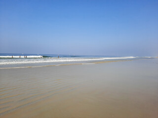 Turquoise water and white sand in beautiful Colva beach, clean water Arabian sea beach, goa beach, tropical beach.